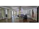 Lobby with comfortable seating, wood flooring, and bright lighting create an inviting common space at 5849 Park N St # 201, St Petersburg, FL 33709