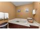 Bathroom showcasing a large soaking tub, towel racks and neutral paint colors at 970 45Th Ne Ave, St Petersburg, FL 33703