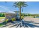 Elegant stone community entrance sign for Primrose Estates with a beautifully landscaped entrance and privacy gate at 18304 Roseate Dr, Lutz, FL 33558