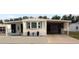 Charming single-story home featuring a large covered parking area and well-maintained front yard at 322 S Port Royal Ln, Apollo Beach, FL 33572