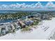 Aerial view of condo with beach access and stunning water views at 3910 Gulf Blvd # 400, St Pete Beach, FL 33706