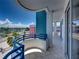 Exterior balcony with blue railings showcasing beautiful waterfront and neighborhood views at 3910 Gulf Blvd # 400, St Pete Beach, FL 33706