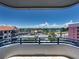 Exterior balcony with blue railings showcasing beautiful waterfront and neighborhood views at 3910 Gulf Blvd # 400, St Pete Beach, FL 33706