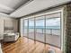 Ocean views from the living room with floor-to-ceiling sliding doors leading to a large balcony at 3910 Gulf Blvd # 400, St Pete Beach, FL 33706
