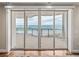 Stunning ocean view from a private balcony with modern railings and tiled flooring at 3910 Gulf Blvd # 400, St Pete Beach, FL 33706