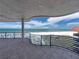 Spacious balcony with curved railing overlooking the white sand beach and ocean view at 3910 Gulf Blvd # 400, St Pete Beach, FL 33706