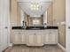 Neutral bathroom features large vanity with black countertop and modern fixtures and fittings at 3910 Gulf Blvd # 400, St Pete Beach, FL 33706