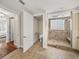 Bathroom boasts a walk-in shower with travertine tile and a separate toilet room at 3910 Gulf Blvd # 400, St Pete Beach, FL 33706