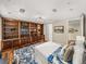Bedroom featuring custom wood bookcase and plush decor at 3910 Gulf Blvd # 400, St Pete Beach, FL 33706