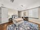 Bright bedroom featuring a plush rug, a writing desk, and a full sized bed at 3910 Gulf Blvd # 400, St Pete Beach, FL 33706