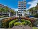 Landscaped entrance featuring lush vegetation and a water feature to provide an inviting arrival at 3910 Gulf Blvd # 400, St Pete Beach, FL 33706