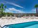 Stunning community pool with lounge chairs and beach access, promising a serene and relaxing experience at 3910 Gulf Blvd # 400, St Pete Beach, FL 33706