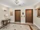 Hallway view of wooden elevators with stylish decor creating a sophisticated ambiance at 3910 Gulf Blvd # 400, St Pete Beach, FL 33706