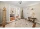 Elegant hallway entrance with marble floors, decor and lighting fixtures creating a luxurious ambiance at 3910 Gulf Blvd # 400, St Pete Beach, FL 33706