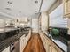 Well-lit kitchen provides custom cabinetry, stainless steel appliances, and dark countertops at 3910 Gulf Blvd # 400, St Pete Beach, FL 33706