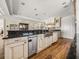 Contemporary kitchen provides custom cabinetry, stainless steel dishwasher, and dark countertops at 3910 Gulf Blvd # 400, St Pete Beach, FL 33706