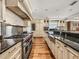 Modern kitchen featuring custom cabinetry and an oversize stove at 3910 Gulf Blvd # 400, St Pete Beach, FL 33706