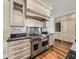 Modern kitchen featuring custom cabinetry and an oversize stove at 3910 Gulf Blvd # 400, St Pete Beach, FL 33706