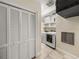Laundry room with front-loading washer and dryer, and built in cabinets at 3910 Gulf Blvd # 400, St Pete Beach, FL 33706