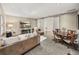 Comfortable living space featuring plush couches, a large flat screen TV, and a dining table at 3910 Gulf Blvd # 400, St Pete Beach, FL 33706