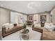 Spacious living area featuring plush couches, modern decor, and an open floor plan at 3910 Gulf Blvd # 400, St Pete Beach, FL 33706