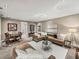 Open living room featuring dining area, plush couch with white pillows and modern decor at 3910 Gulf Blvd # 400, St Pete Beach, FL 33706