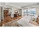 Elegant main bedroom featuring hardwood floors, ocean views, and a walkout balcony at 3910 Gulf Blvd # 400, St Pete Beach, FL 33706