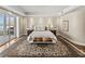 Spacious main bedroom featuring beautiful flooring, dresser, and an ocean view at 3910 Gulf Blvd # 400, St Pete Beach, FL 33706