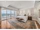Bright main bedroom with ocean views, a decorative rug, and a king-sized bed at 3910 Gulf Blvd # 400, St Pete Beach, FL 33706