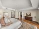 Inviting main bedroom with warm wood floors, ocean views, and a luxurious bed at 3910 Gulf Blvd # 400, St Pete Beach, FL 33706