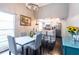 Dining area shows white table and overlooks the kitchen with bar stool seating at 4405 Timber Terrace Cir, Tampa, FL 33624