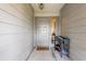 Home entryway featuring a decorative rug, gray front door with sidelight and a shoe rack at 4405 Timber Terrace Cir, Tampa, FL 33624