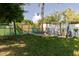 Relaxing backyard with a hammock and swing set for outdoor enjoyment at 6145 55Th N Ave, St Petersburg, FL 33709