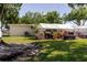 Backyard with covered patio area and plenty of green space to enjoy at 6145 55Th N Ave, St Petersburg, FL 33709