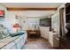 Bright bedroom featuring wood floors, a TV, and comfortable furnishings at 6145 55Th N Ave, St Petersburg, FL 33709