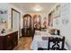 Cozy dining room featuring beach-themed decor, wood floors, and vintage furnishings at 6145 55Th N Ave, St Petersburg, FL 33709