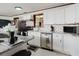 Stylish kitchen with granite counters, stainless steel appliances, and white cabinetry at 6145 55Th N Ave, St Petersburg, FL 33709