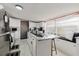 Spacious kitchen featuring white cabinets, a large island, and stainless steel appliances at 6145 55Th N Ave, St Petersburg, FL 33709