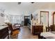 Comfortable living room featuring wood floors, ample seating, and lots of natural light at 6145 55Th N Ave, St Petersburg, FL 33709