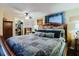 Comfortable main bedroom featuring a large bed, ceiling fan, and walk-in closet at 6145 55Th N Ave, St Petersburg, FL 33709