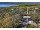 Charming home nestled among trees with water views creating a serene and private setting at 7418 Bay Dr, Tampa, FL 33635