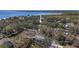 Bird's-eye view of the property, showcasing its location nestled amongst lush foliage close to a body of water at 7418 Bay Dr, Tampa, FL 33635