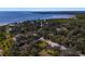 Aerial view of the property, nestled amongst lush foliage and conveniently situated close to the open waters of the bay at 7418 Bay Dr, Tampa, FL 33635