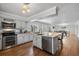 Well-appointed kitchen featuring stainless appliances, granite countertops and island seating at 7418 Bay Dr, Tampa, FL 33635
