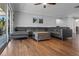 Inviting living room with comfortable sofa and hardwood floors at 7418 Bay Dr, Tampa, FL 33635