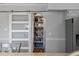 Pantry features sliding barn door with shelving for ample storage at 7418 Bay Dr, Tampa, FL 33635