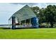 Outdoor stage with vibrant artwork in a park setting, offering a venue for events and performances at 7418 Bay Dr, Tampa, FL 33635