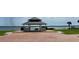 Pavilion offering scenic water views, with a brick parking area and landscaped surroundings at 7418 Bay Dr, Tampa, FL 33635
