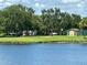 Neighborhood park with a playground and a covered picnic area next to a pretty pond at 7418 Bay Dr, Tampa, FL 33635