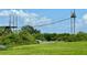 Outdoor adventure park with suspension bridge crossing over green landscape and a small waterway at 7418 Bay Dr, Tampa, FL 33635